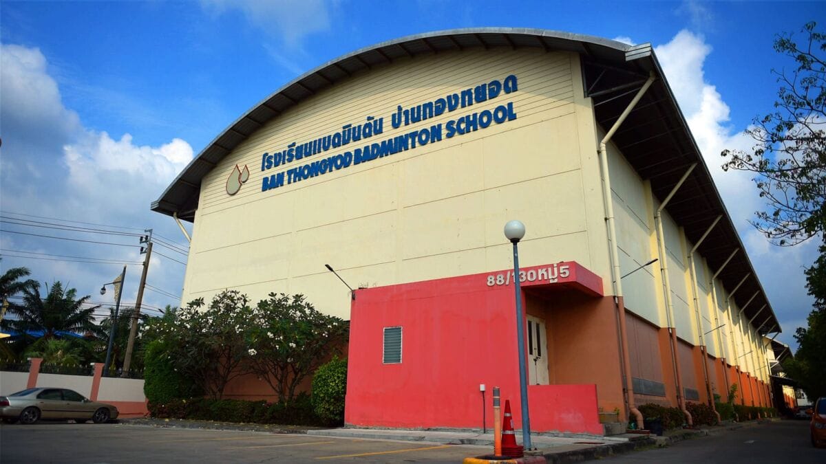 The Banthongyord Badminton School building, with the school name in Thai and English on the front wall